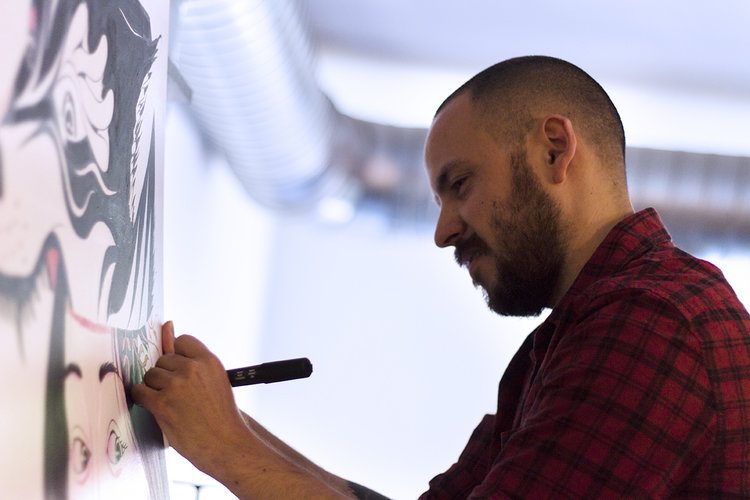 Pierre Kleinhouse drawing a mural